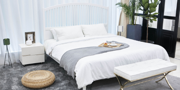 staged bedroom with large bed and decor
