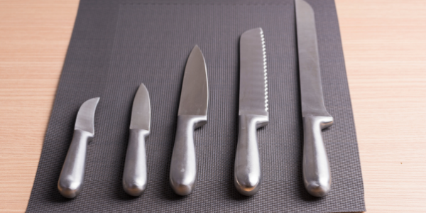 knives laid out on a mat